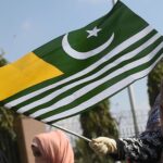 A protester waves Kashmire flag as they march during a demonstration against India, in Karachi on February 4, 2020. - Pakistan will observe Kashmir Solidarity Day on February 5, to express solidarity with their fellow Kashmiri's living in Indian administered Kashmir.  (Photo by Rizwan TABASSUM / AFP)